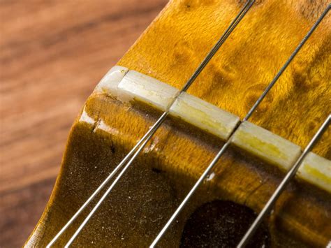 broken nut on acoustic guitar.